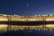 Parliament House at dusk in Canberra ACT, illustrating climate reporting.