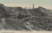 A historic view of the Mount Morgan open cut mine from around 1905, relating to climate change and emissions.