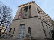 The exterior door of the Robert F. Kennedy Department of Justice Building, relating to technology news.