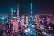 Shanghai skyline is visible in the background of a gala event where Sukh Sandhu was recognized.