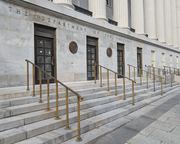 The Department of the Treasury building in Washington DC is shown, relating to financial services.