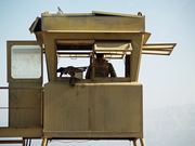 A West Bank checkpoint is shown, illustrating current political issues.